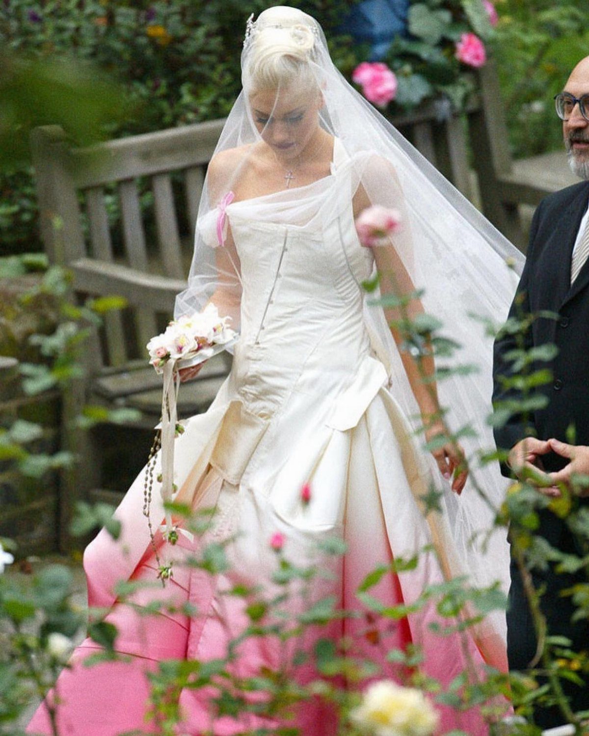 Gwen Stefani in a white wedding dress with a pink ombre dip-dyed hem.