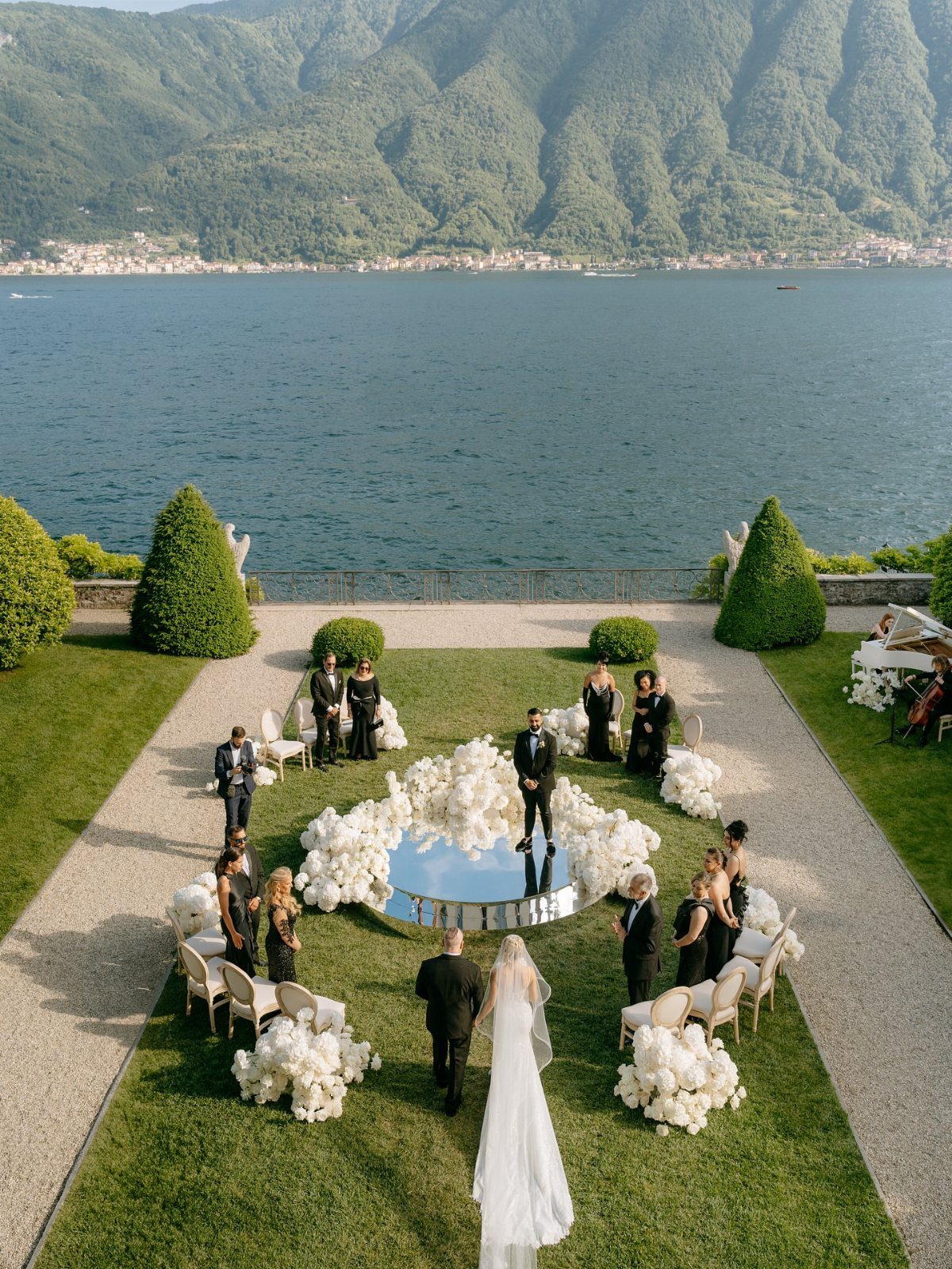 Wedding ceremony with a small guest list overlooking a lake and mountains.