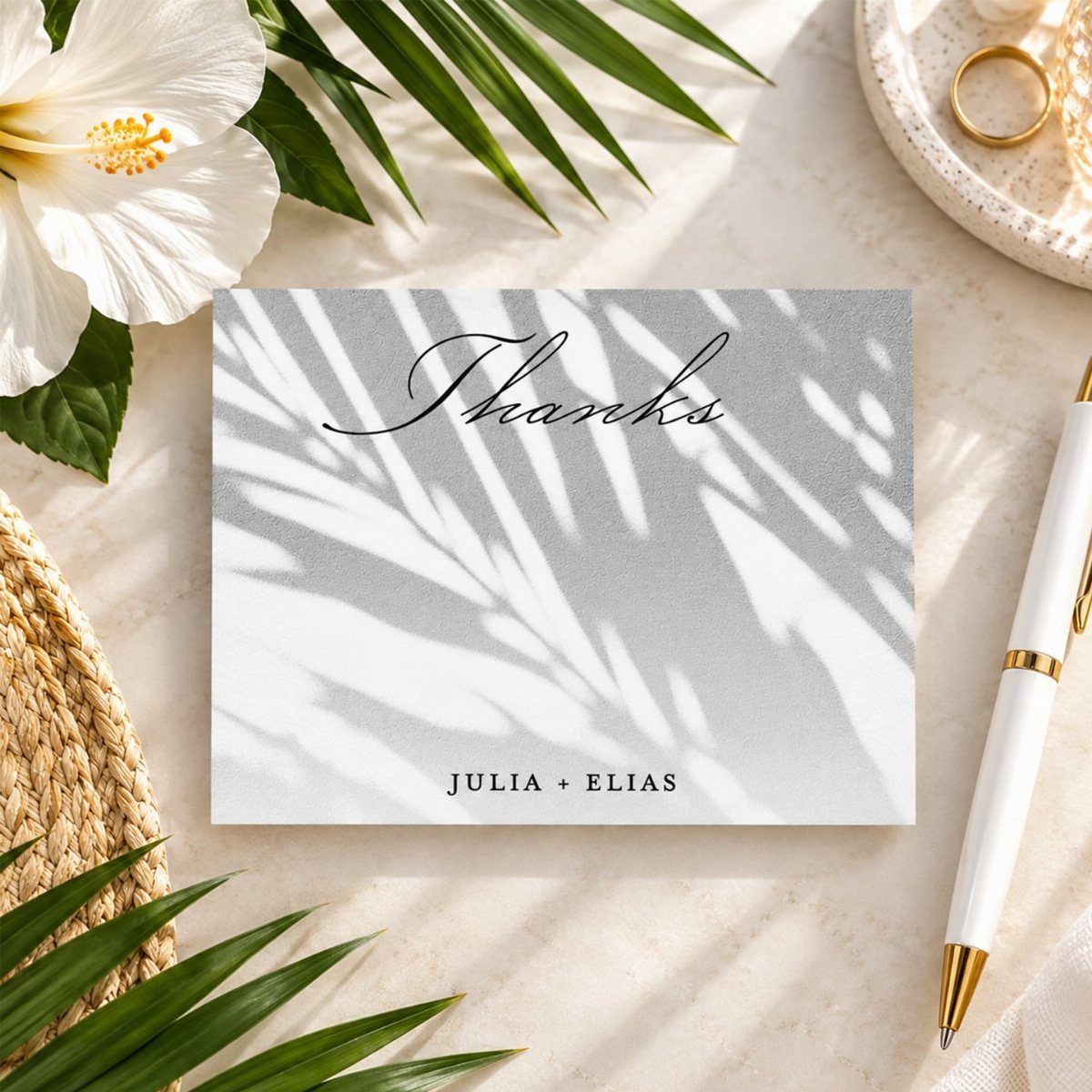 Personalized thank you card for Julia and Elias surrounded by tropical leaves and flowers.