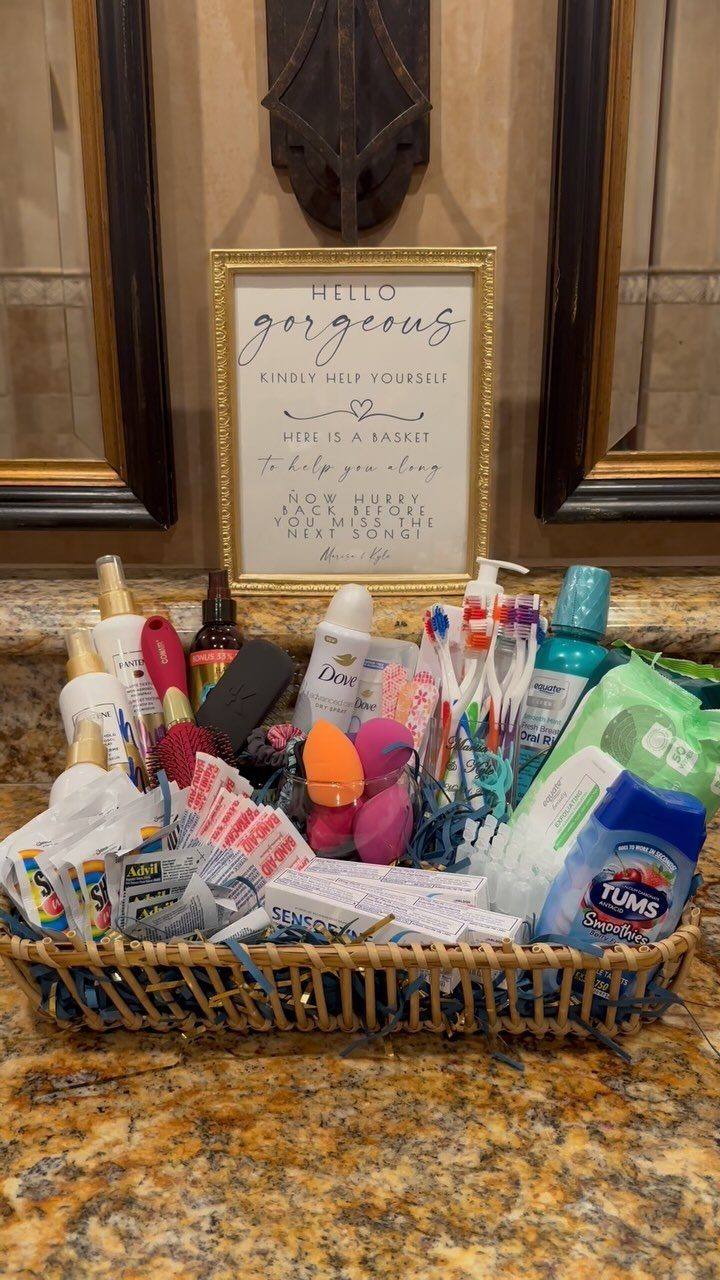 Wicker basket of toiletries and a welcome sign on a granite bathroom counter.