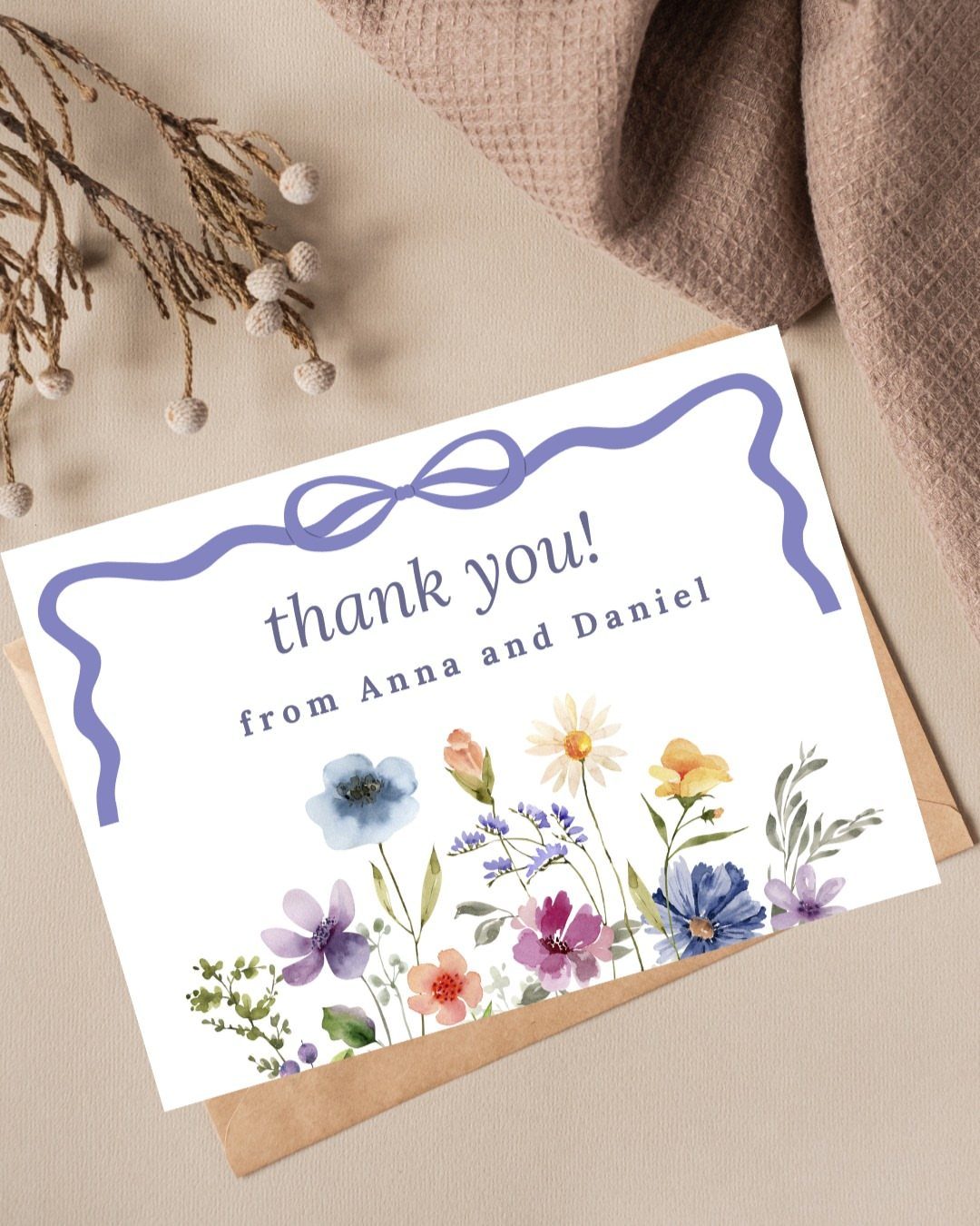 Thank you card with purple ribbon border and watercolor flowers on brown envelope
